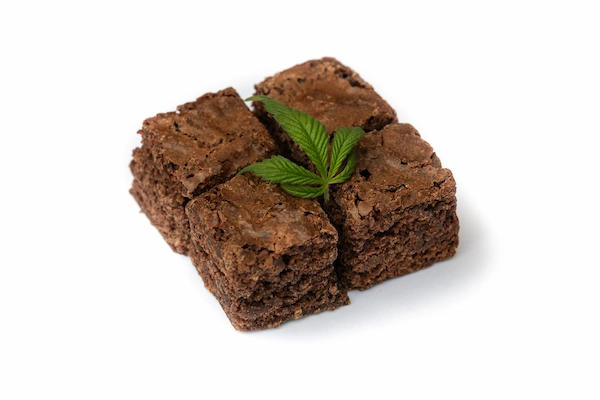 picture of brownie with marijuana leaf on top